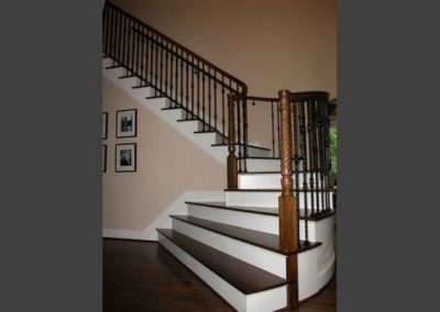 … with a curved staircase to open up the entry way and fully expose the beautiful music room.  Built in cabinetry was added to the family room and the old tin can fireplaces were replaced with new more aesthetically pleasing and energy efficient gas fireplaces in the family room and music room.